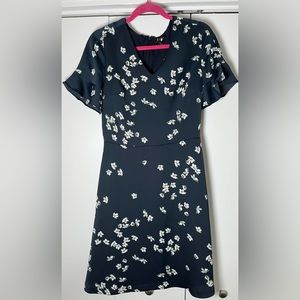 Flutter sleeve, fitted body, flared skirt